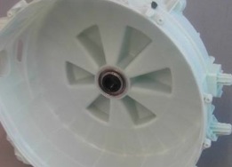 Washing machine rear tub section with bearings